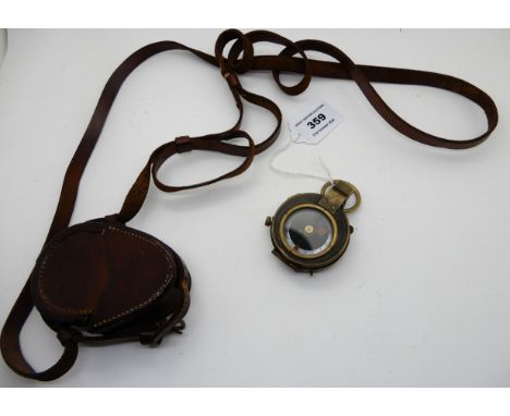 A WWI military compass in leather case Condition Report: The compass is not in working order.
