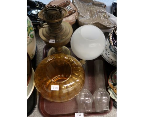 A brass oil lamp with amber glass shade etc Condition Report: Not available for this lot