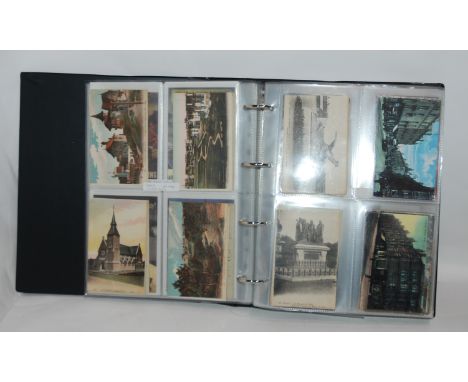Two albums of colour and black and white vintage and later postcards Condition Report: Available upon request