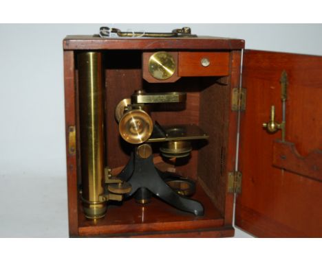 A brass microscope in fitted case Condition Report: Available upon request
