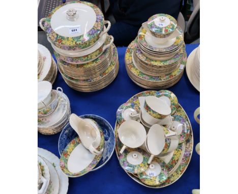 A Wilkinson Ltd Springtime chintz pattern dinner service comprising plates, bowls, soup coupes, sauce boat etc, together with