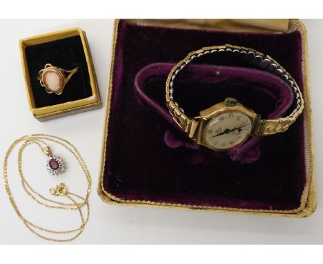 A 9ct ruby and diamond pendant, 9ct cameo ring weight together 4.3gms and a 9ct cased Smiths ladies watch Condition Report: A