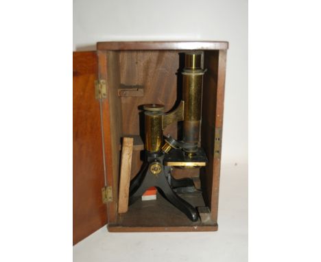A brass microscope in fitted case and two boxes of slides Condition Report: Available upon request