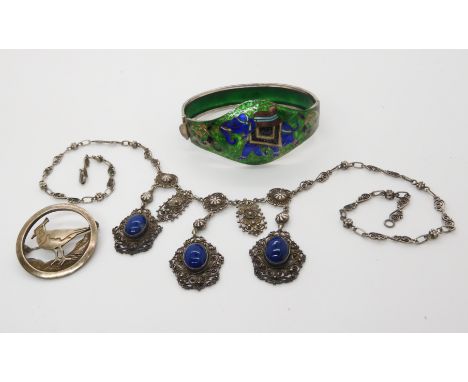 A white metal enamelled bangle depicting elephants, a Norwegian style filigree necklace and a Ortak silver lapwing brooch Con