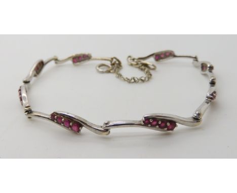 A 9ct white gold ruby set bracelet, weight 5.9gms Condition Report: Available upon request