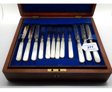 A cased twenty four piece silver and mother of pearl dessert cutlery set, Sheffield 1914 with four EP and mother of pearl des