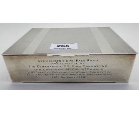 A silver cigarette box, rubbed London marks, with engine turned decoration, 17cm x 12.5cm (Bears an inscription) Condition Re