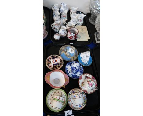 A collection of Royal Worcester jugs and assorted cabinet cups and saucers Condition Report: Available upon request