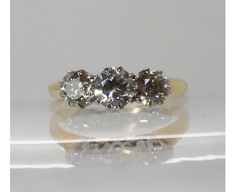 An 18ct gold three stone diamond ring of estimated approx 0.90cts combined, finger size M1/2, weight 3gms Condition Report: S