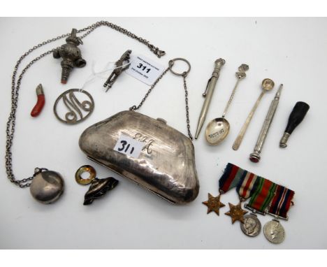 A lot comprising a silver purse, sovereign case, part baby rattle, pencil holders, WWII miniature medals etc Condition Report