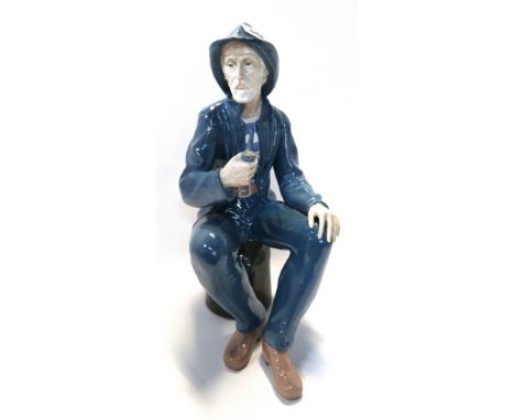 A Nao figure of a fisherman smoking a pipe Condition Report: restoredª