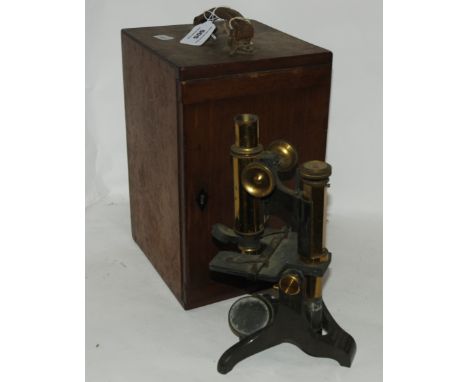 A brass microscope by Baker, London (def) in case Condition Report: Available upon request