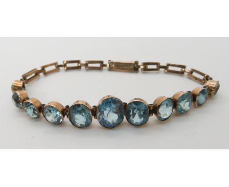 A 9ct gold blue zircon set bracelet length 15cm, weight 6.5gms Condition Report:Clasp, chain and mounts all ok, some light ab