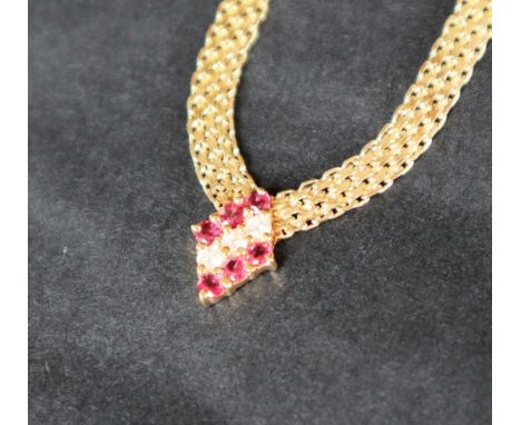 A 14ct yellow gold ruby &amp; diamond necklace, set with six round faceted rubies and three round brilliant cut diamonds, 41c