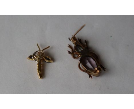 An 18ct yellow gold sapphire and diamond insect pendant set with two pointed oval sapphire wings and a diamond set head, 21mm
