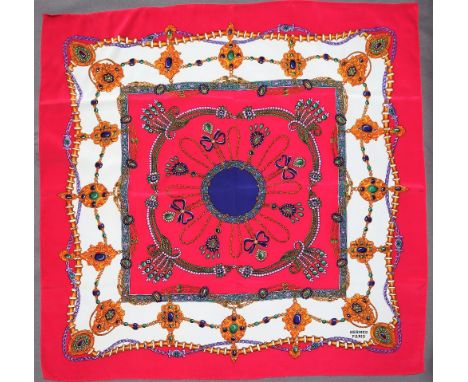 An Hermes silk scarf printed with jewellery retailed by Cartier, with  certificate and box