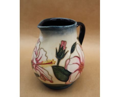 A Moorcroft Limited Edition 'Hibiscus Moon' pottery jug designed by Sian Leeper, No.98/250, dated 2002, impressed and painted