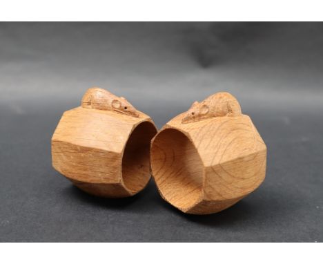 A pair of Mouseman oak napkin rings, by Robert 'MOUSEMAN' Thompson of octagonal shape, carved mouse signature with long tail 