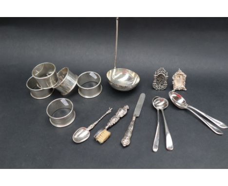 Silver napkin rings together with silver tea spoons, silver mustard spoons,. miniature photograph frames, approximately 135 g