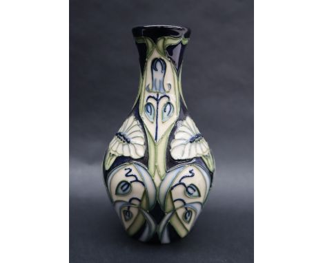 A Moorcroft pottery "Rain Daisy" pattern baluster vase, dated 2004, impressed and painted marks, 14cm high 