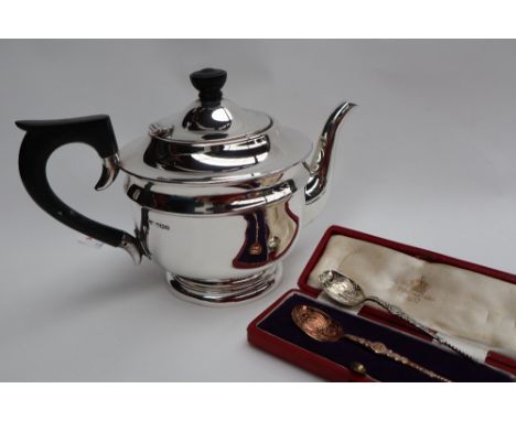 A George VI silver teapot, on a spreading foot, Sheffield, 1937, together with a silver coronation spoon, cased approximately