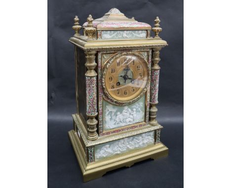 A French champleve enamel and pate sur pate decorated mantle clock, of architectural form, the gilt dial with Arabic numerals