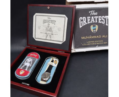 Boxing -The Greatest -  A fossil watch, cast with Muhammad Ali to dial, in a tin, in a wooden box, a black and white action s