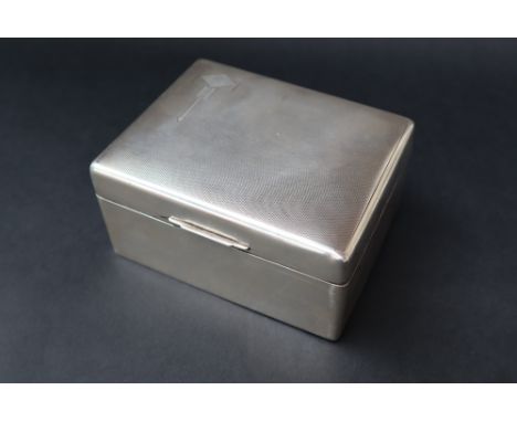 An Elizabeth II silver cigarette box of rectangular form with engine turned decoration, Sheffield, 1954, Walker &amp; Hall, 1