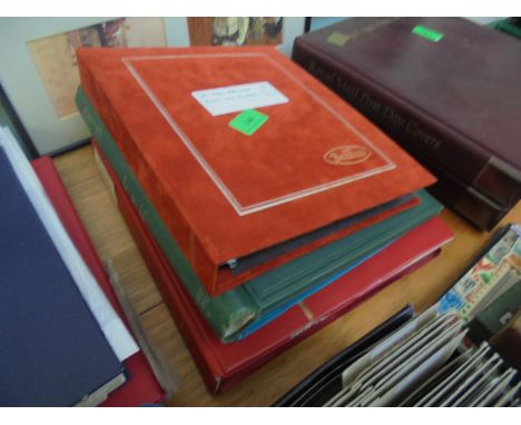 4 albums partly filled with mixed stamps and First Day Cover