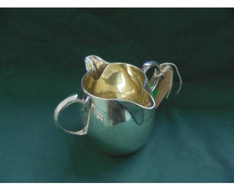 Victorian silver gilt double handled and double spouted cream jug (London 1881)