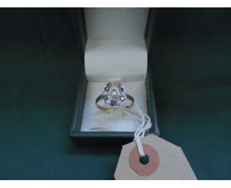 Vintage ruby and pearl horseshoe shaped ring