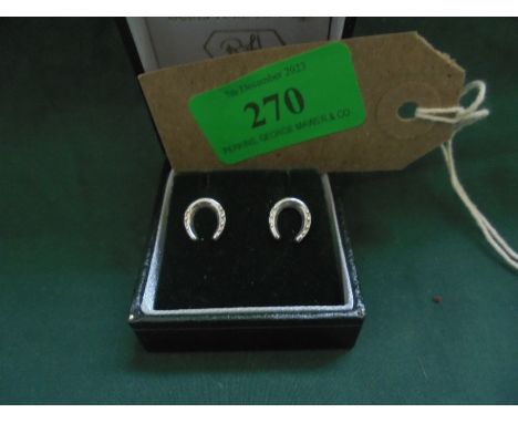 Pair of silver horseshoe ear studs marks on butterflies