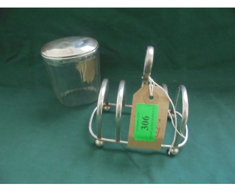 2 silver items being a toast rack (Birmingham 1930) and silver topped dressing table container (London 1919)