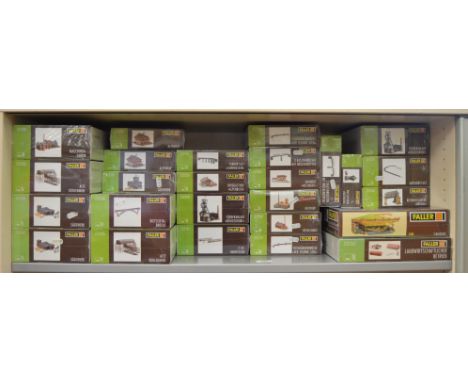 N Gauge. Ex - Shop Stock. 26 boxed Faller railway related model kits including 'Alpine Farm', Bridges, 'Iron Foundry'&nbsp; e
