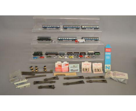 N Gauge. A small collection of unboxed Railway items including 2 Locomotives and 5 Coaches&nbsp; by Trix and Lima, 7 Wagons b