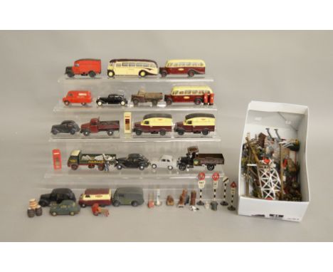 O Gauge. 19 unboxed metal vehicles including vans, cars etc., with some weathering and repainting, together with a box contai