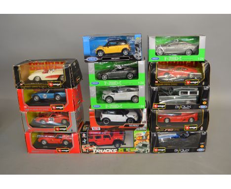 14 boxed 1:24 scale diecast models by Burago, NEX etc, some models are loose in the box and one appears to have been taken ap