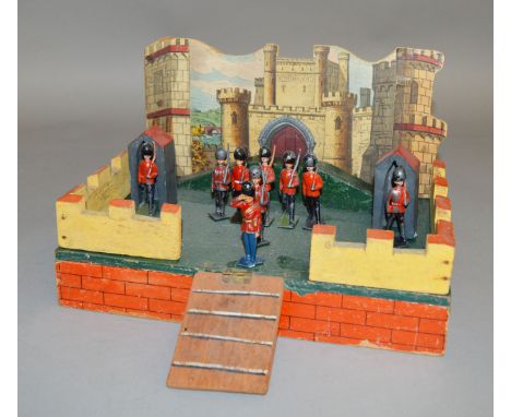 An unboxed vintage wooden fort toy, the base of which measures approximately 28 x 19.5cm. A label affixed to the underside of