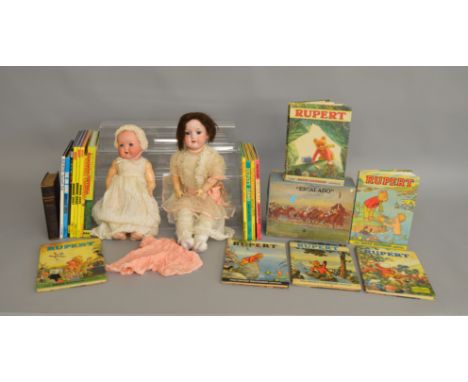 A mixed group of toys and Annuals including two porcelain headed Dolls, a vintage boxed 'Escalado' game,&nbsp; six Rupert Ann