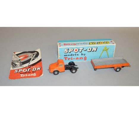 A boxed Tri-ang Spot On 106A/1 'Austin Prime Mover with Articulated Flat Float with Sides' in orange. Scammell coupling mecha