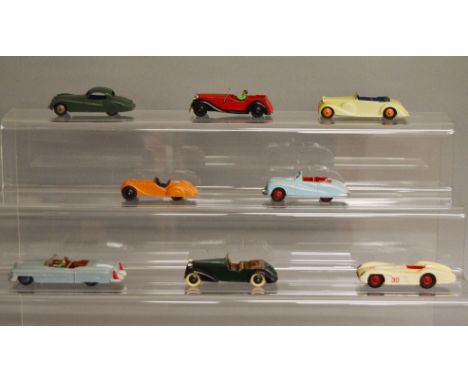 8 unboxed Dinky Toys including 157 Jaguar, 38d Alvis and 106 Austin Atlantic. Models have varying degrees of playwear and/or 