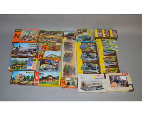 HO and N Gauge. 17 boxed Trackside Accessory kits by Piko, Faller, Heljan and others together with 13 accessory packs by Fall