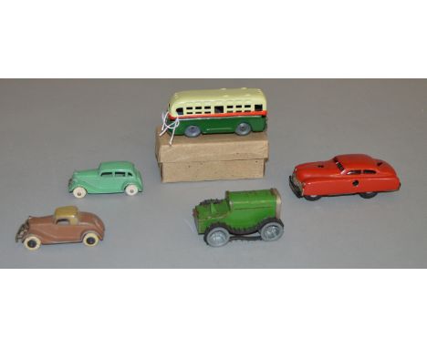 A small selection of unboxed diecast and tinplate vehicles including Tootsietoys Coupe and Sedan Tourers, a Tri-ang Minic Tra