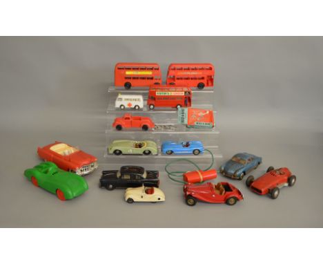 14 unboxed vintage vintage Plastic and Tinplate vehicles including a scarce Tri-ang #290 large scale plastic model of a Cadil