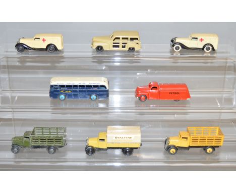 8 unboxed Dinky Toys including 2 x 25f Market Gardeners Wagons  and 2 x 30F Ambulance models. Models have varying degrees of 