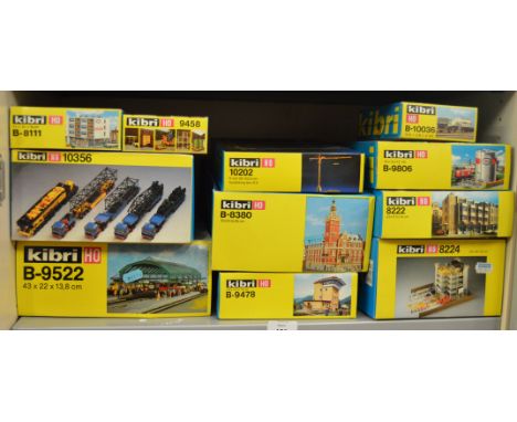 12 boxed Kibri model kits in HO scale including #B-8380 Town Hall, 10202 Crane kit, 10356 Crane Transport set, etc.  All kits