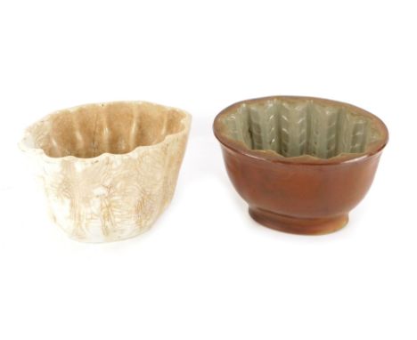 Two 19thC ceramic jelly moulds, comprising a white glazed finished mould, stamped Made in England with anchor crest, and mark