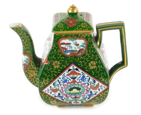 A 19thC Ashworth ironstone teapot, of angular bulbous form, decorated with reserves of flowers and Buddhist symbols, against 