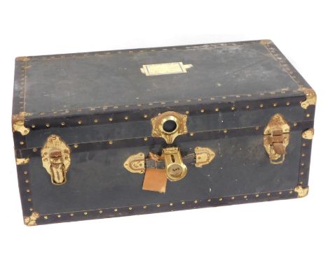 A blue bound canvas trunk, with brass buckled corners and supports, 31cm high, 78cm wide, 42cm deep. 