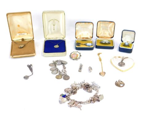 A quantity of costume jewellery, comprising silver charm bracelet, silver coin pendant, Wedgwood necklaces, silver lockets, e